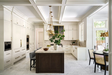 Inspiration for a large transitional marble floor kitchen remodel in Chicago with a farmhouse sink, white cabinets, quartzite countertops, stone slab backsplash and an island