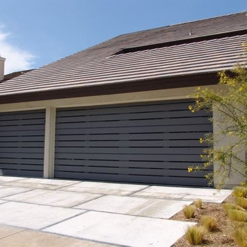 Modern wood garage door with sleek windows - Contemporary Design