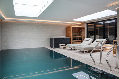 Photo of a contemporary swimming pool in London.