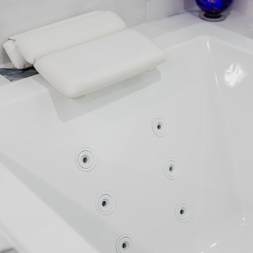 Bathroom remodeling in Columbia, MD with double vanity & marble bathtub