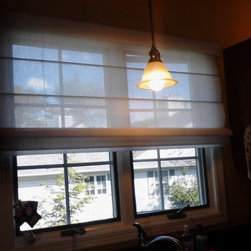 solar shade in a roman style - Window Treatments
