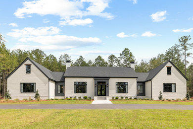 Example of a farmhouse exterior home design in Atlanta