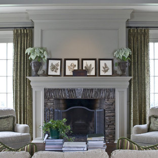Family room - traditional family room idea in Atlanta with beige walls, a standard fireplace, a stone fireplace and no tv