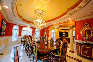 Example of a large marble floor great room design in Baltimore with red walls and no fireplace
