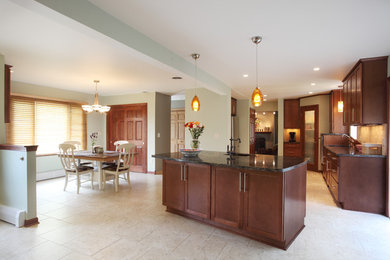 Inspiration for a large l-shaped ceramic tile and beige floor kitchen remodel in Milwaukee with granite countertops, an island, a double-bowl sink, recessed-panel cabinets, medium tone wood cabinets, beige backsplash, ceramic backsplash and stainless steel appliances