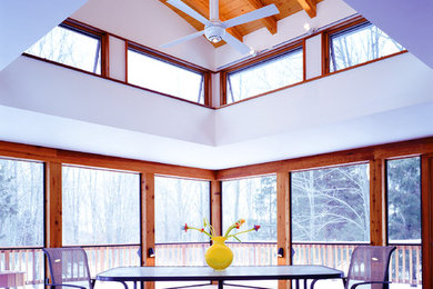 Example of a mid-sized trendy dark wood floor sunroom design in Philadelphia with a skylight