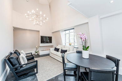 Inspiration for a medium sized contemporary open plan living room in London with white walls, a ribbon fireplace, a plastered fireplace surround, a wall mounted tv and grey floors.