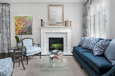 Inspiration for a small transitional formal dark wood floor living room remodel in Chicago with gray walls, a standard fireplace, a stone fireplace and no tv