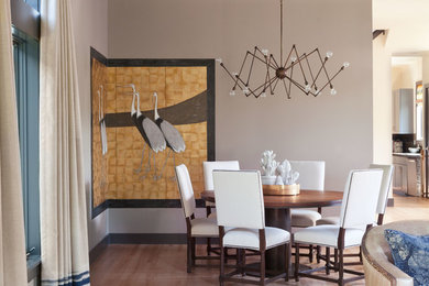 Inspiration for a large transitional light wood floor great room remodel in Denver with beige walls