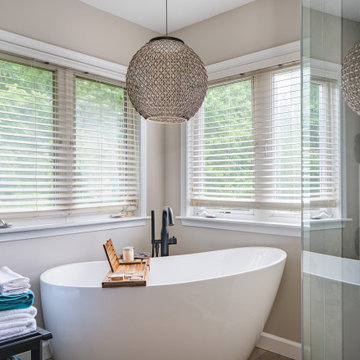Bathroom Remodel in Sterling, VA Tub, glass shower, double vanity, stone wall