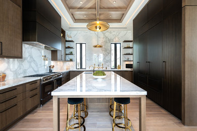 Contemporary u-shaped kitchen in Miami with an undermount sink, flat-panel cabinets, dark wood cabinets, white splashback, marble splashback, panelled appliances, light hardwood floors and with island.