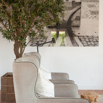 Pale Armchair Beside Indoor Tree, Birre Living Room