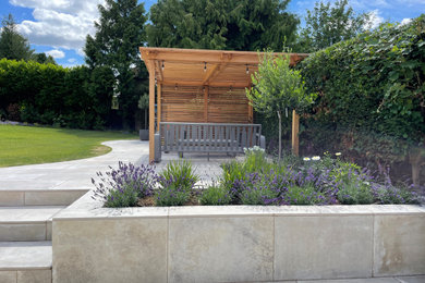 Esempio di un grande giardino design esposto in pieno sole dietro casa in estate con recinzione in legno