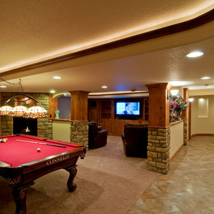 Inspiration for an expansive rustic walk-out basement in Providence with yellow walls, carpet, a standard fireplace and a stone fireplace surround.