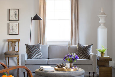 Example of a transitional dark wood floor living room design in New York with white walls