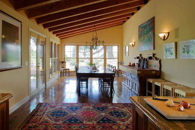 Inspiration for a large traditional dining room in San Diego with beige walls, medium hardwood floors, no fireplace and brown floor.