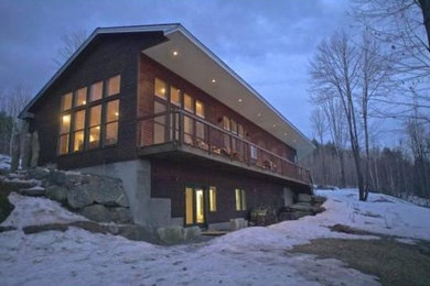 Example of a trendy wood exterior home design in New York