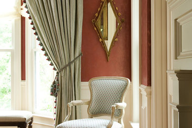 Inspiration for a large victorian enclosed medium tone wood floor and brown floor family room remodel in Boston with beige walls, a standard fireplace and a stone fireplace