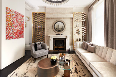 This is an example of a large contemporary formal living room feature wall in London with beige walls, dark hardwood flooring, a standard fireplace, a stone fireplace surround, a built-in media unit, wallpapered walls and brown floors.