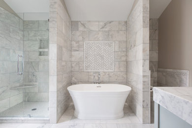 Bathroom - traditional white tile and marble tile marble floor and vaulted ceiling bathroom idea in St Louis with beige walls, marble countertops, a hinged shower door, white countertops and a built-in vanity