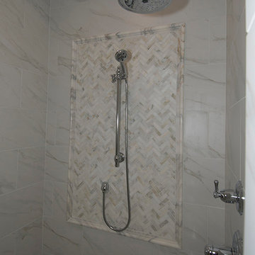 combination of porcelain & natural callacatta marble in expanded shower
