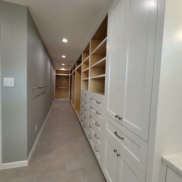 Two separate bathrooms converted into a master bathroom with a big open closet