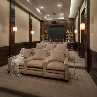 Home theater - mid-sized transitional enclosed carpeted and beige floor home theater idea in Dallas with beige walls and a projector screen