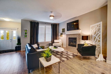 Example of a transitional family room design in Calgary