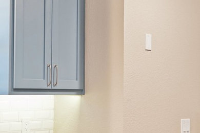Kitchen - modern kitchen idea in Dallas with blue cabinets