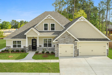 Large elegant two-story house exterior photo in Other with a shingle roof