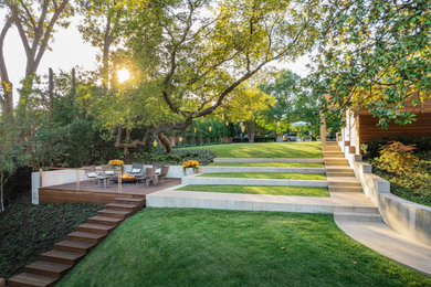 This is an example of a modern backyard concrete paver landscaping in Dallas.