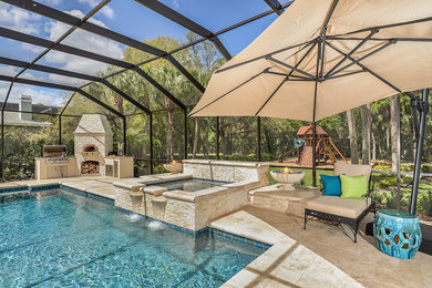 Photo of an expansive traditional backyard deck in Tampa.