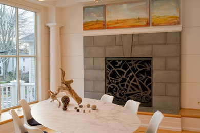 Inspiration for a large contemporary light wood floor enclosed dining room remodel in Bridgeport with beige walls, a standard fireplace and a stone fireplace