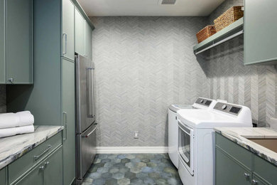 Mid-sized transitional galley porcelain tile, multicolored floor and wallpaper dedicated laundry room photo in Dallas with an undermount sink, recessed-panel cabinets, green cabinets, quartz countertops, gray walls, a side-by-side washer/dryer and white countertops