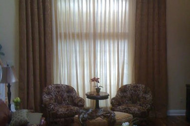 Living room - traditional living room idea in Other