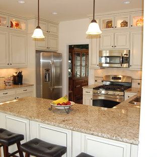 Large kitchen pantry remodeling - Kitchen pantry - large u-shaped ceramic floor kitchen pantry idea in Richmond with recessed-panel cabinets, white cabinets, granite countertops, beige backsplash, ceramic backsplash and stainless steel appliances