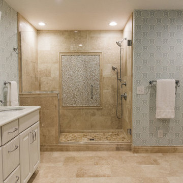 Traditional master bath with travertine