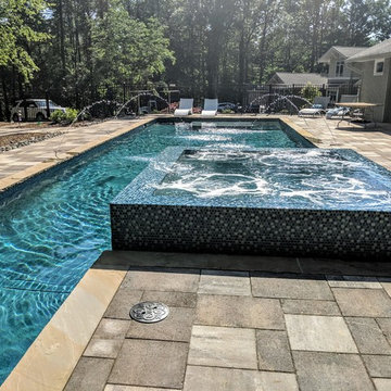 Gorgeous Glass Tile 360 Spillover Spa and lap pool