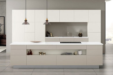 Minimalist single-wall concrete floor and gray floor eat-in kitchen photo with an undermount sink, flat-panel cabinets, medium tone wood cabinets, wood countertops, brown backsplash, wood backsplash, stainless steel appliances and an island
