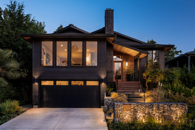 Mid-sized gray two-story wood and clapboard exterior home photo in Seattle with a shingle roof