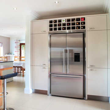 Handled contemporary kitchen with freestanding fridge/freezer