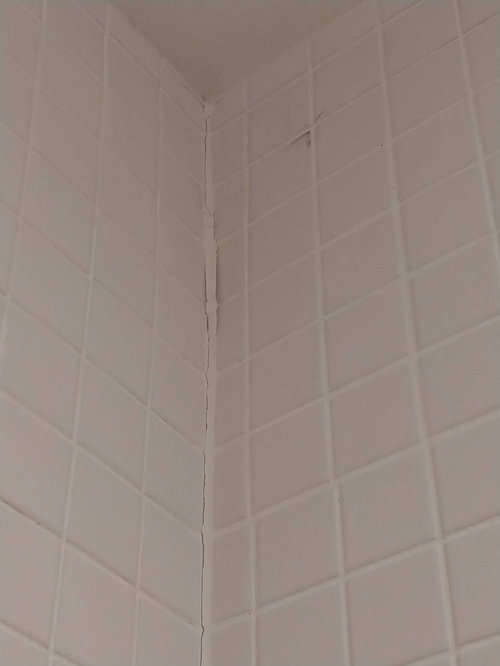 Grout cracking in bathroom corner walls on 7 month old bathroom