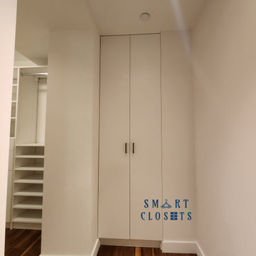 Customized Master Walk In Closet and Home Office Desk Designed By Smart Closets