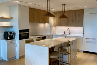 Inspiration for a mid-sized contemporary l-shaped light wood floor open concept kitchen remodel in Toronto with an undermount sink, flat-panel cabinets, quartz countertops, white backsplash, quartz backsplash, paneled appliances, an island and white countertops