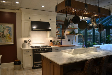 Inspiration for a mid-sized transitional porcelain tile eat-in kitchen remodel in New York with shaker cabinets, white cabinets, marble countertops, white backsplash, subway tile backsplash and an island