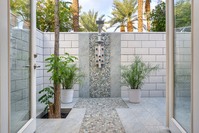 Inspiration for a contemporary outdoor patio shower remodel in Phoenix