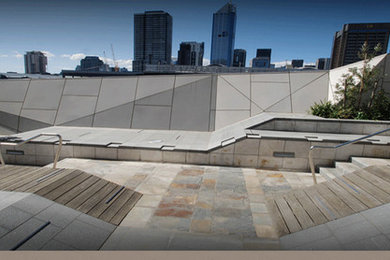 Photo of an expansive contemporary rooftop deck in Melbourne with a container garden and no cover.