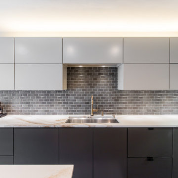 Modern Renowned Cabinetry, Backsplash, and Cambria Surfaces Counter Top