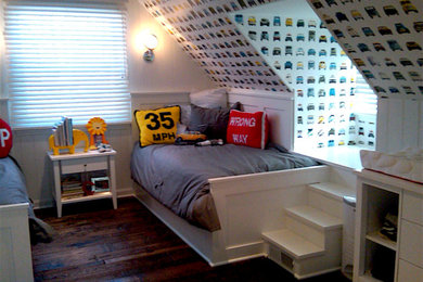 Inspiration for a mid-sized eclectic boy dark wood floor kids' room remodel in Milwaukee with white walls