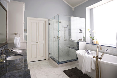Large transitional master marble floor bathroom photo in Dallas with an undermount sink, white cabinets and blue walls